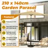 A garden parasol is shown set up on a patio with two lounge chairs. Produktbild-Vorschau