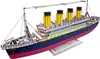 A 3D wooden model of the Titanic ship is displayed against a white background. Produktbild-Vorschau