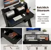 A collage of images showing a black computer desk with a monitor, keyboard, mouse, books, and a plant. One image shows a drawer with items inside, and another shows the desk with a monitor riser. Produktbild-Vorschau