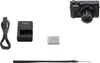 A product shot of a Canon camera and its accessories on a white background. Produktbild-Vorschau