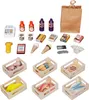 A collection of toy grocery items and accessories, including food items, a cash register, and a shopping bag, arranged on a white background. Náhľad obrázku produktu