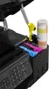 Close-up view of a printer's ink refilling system with ink bottles and cartridges. Produktbild-Vorschau