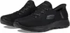 A pair of black Skechers slip-on sneakers. Náhled obrázku produktu