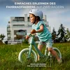 A young child is riding a balance bike in a grassy outdoor setting with a modern building in the background. Náhľad obrázku produktu