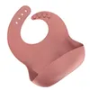 A single silicone bib is shown against a white background. Voir les images du produit