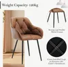 A brown upholstered chair with black metal legs, shown with close-up details of its construction and text highlighting its weight capacity and sturdiness. Produktbild-Vorschau