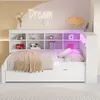 A child's bed with a built-in bookshelf and LED lighting. Produktbild-Vorschau