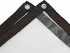 Close-up view of two corners of a transparent tarp with reinforced edges and grommets. Podgląd zdjęcia produktu