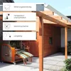 A covered outdoor seating area with wooden structures and a chair. Produktbild-Vorschau