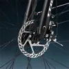 Close-up of a bicycle's front wheel brake system. Produktbild-Vorschau