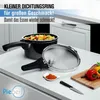 A pressure cooker with its lid, spices, and vegetables on a kitchen counter. Produktbild-Vorschau