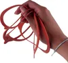 A hand holding several red rubber gaskets. Anteprima dell’immagine prodotto