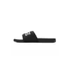 A black VANS slide sandal with white VANS lettering on a white background. Anteprima dell’immagine prodotto