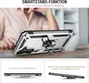 A person's hands are visible behind a silver phone case with a ring stand, in a lifestyle setting. Produktbild-Vorschau