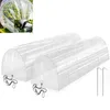 Two clear plastic mini greenhouses in a tunnel shape, with metal stakes. Produktbild-Vorschau