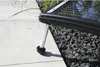A close-up of a solar collector leg resting on a patio and gravel. Podgląd zdjęcia produktu