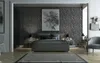 A modern bedroom with textured walls, a bed, and a chair. Produktbild-Vorschau