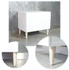Close-up views of the legs of a white cabinet. Produktbild-Vorschau