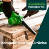 A person wearing black gloves is using a green mini chainsaw to cut a wooden pallet. Produktbild-Vorschau