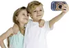 Two children are taking a selfie with a digital camera. Podgląd zdjęcia produktu