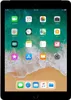 A black Apple iPad tablet displaying its home screen with various app icons. Podgląd zdjęcia produktu