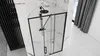 A modern bathroom with a black framed glass shower enclosure. Produktbild-Vorschau