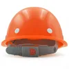 A front view of an orange construction helmet on a white background. Produktbild-Vorschau