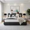 A mother and child are playing on a bed in a bedroom. Produktbild-Vorschau