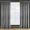 Two gray curtains are drawn back to reveal a window with a grid pattern. The curtains are made of a soft, textured fabric and hang from a metal rod. Produktbild-Vorschau