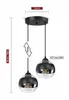 A black and transparent glass pendant light with two spherical lamps. Podgląd zdjęcia produktu