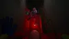 A dark, eerie hallway with a pink spider-like toy hanging from the ceiling. Produktbild-Vorschau