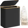 A black laundry hamper with a bamboo rim and lid is shown next to three mesh laundry bags filled with clothes. Produktbild-Vorschau