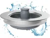A sink strainer with water splashing around it. Produktbild-Vorschau