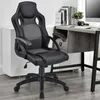 A black and gray ergonomic office chair is placed in a room with a desk and a white cabinet. Náhled obrázku produktu