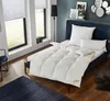 A bedroom scene with a bed made up with a white duvet and pillows, next to a window. Produktbild-Vorschau