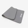 A gray yoga mat is shown on a white background. Produktbild-Vorschau
