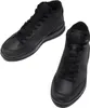 A pair of black high-top leather boots on a white background. Voir les images du produit