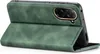 A green flip cover case for a smartphone is shown open, propped up on its cover. Produktbild-Vorschau