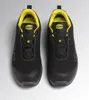 A top-down view of a pair of black safety shoes with yellow accents. Produktbild-Vorschau