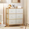 A dresser with six drawers and a wooden frame, placed in a room with a lamp and a sofa. Podgląd zdjęcia produktu