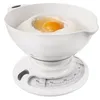 A white mechanical kitchen scale with a bowl containing flour and an egg. Voir les images du produit