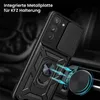 A black phone case with a ring holder and a sliding camera cover is shown attached to a car vent with a magnetic mount. Produktbild-Vorschau
