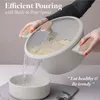 A person is pouring water from a pot with pasta into a bowl. Náhled obrázku produktu