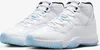 A pair of white Nike Air Jordan 11 Retro sneakers with light blue soles. Produktbild-Vorschau
