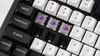 A close-up view of a mechanical keyboard with some keycaps removed, revealing the switches. Produktbild-Vorschau