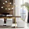 A dining room with a chandelier, table, chairs, and a fireplace. Produktbild-Vorschau