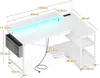 An L-shaped desk with integrated LED lighting and shelving, shown with dimensions. Produktbild-Vorschau