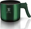 A green milk jug with a handle, placed on a white surface with a reflection. Anteprima dell’immagine prodotto