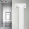 A white ventilation pipe fitting is mounted on a textured wall, with a blurred hallway in the background. Náhľad obrázku produktu