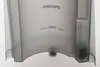 Close-up of a translucent gray Philips water tank with a "MIN" indicator line. Produktbild-Vorschau
